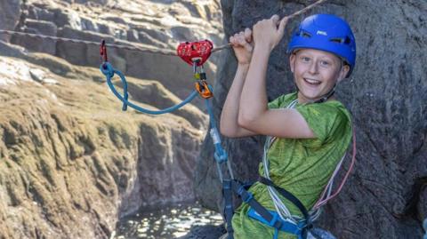 Aden Thurlow wearing a climbing helmet