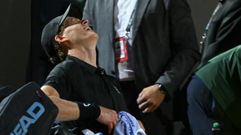 Jannik Sinner looks in out of breath during his match against Daniil Medvedev at the Italian Open 