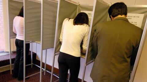 Voters in polling booth
