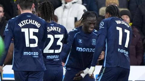 A smiling Romain Esse celebrates with his Coventry team-mates