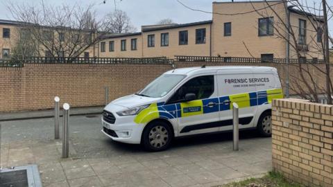 Police forensics van at scene