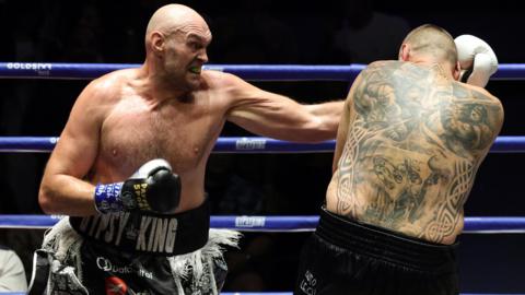 Tyson Fury lands a punch on Mariusz Wach