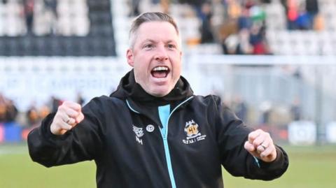 New Cambridge United boss Neil Harris celebrates their win over Stockport