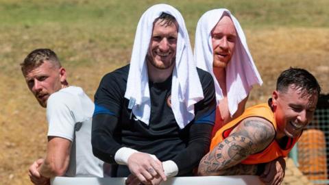 Sweating it out - in the ice bath - Hearts players cool off under the Marbella sun in 2022