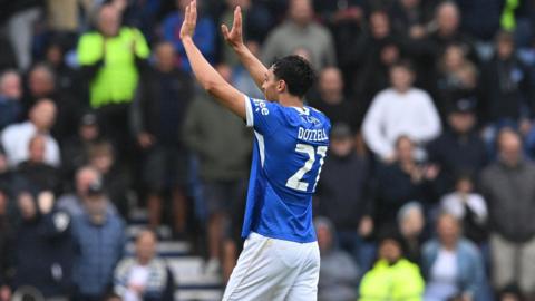 Andre Dozzell celebrates after scoring for Portsmouth