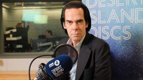 Nick Cave in a BBC studio looking at the camera