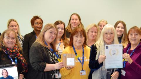 Healthcare workers from Somerset's carer assessment service with their NHS award