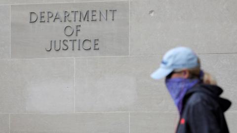 Signage is seen at the headquarters of the United States Department of Justice (DOJ) in Washington, 10 May 2021