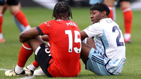 Nottingham Forest's Anthony Elanga speaks with Luton Town's Teden Mengi