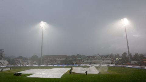 Rain covers come in during the second women's ODI between England and Pakistan