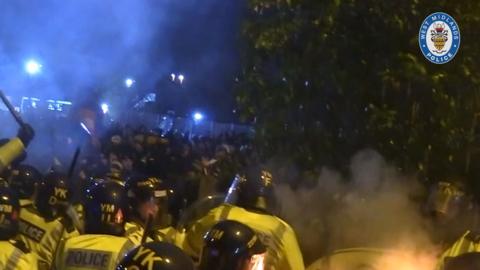 police clash with crowd of football fans