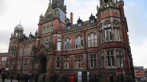 The exterior of York Magistrates Court - an imposing redbrick Victorian building.