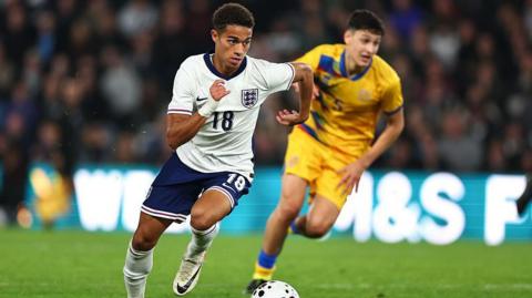 Josh King races away from a defender during England Under-21s match against Andorra Under-21s