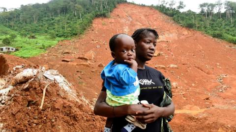 A widow speaks to journalists about the loss of her husband in the mudslides that hit Freetown in August 2017