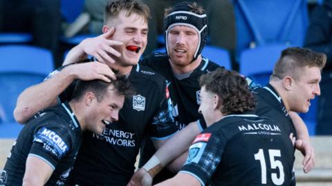 Warriors' George Horne celebrates after scoring a try with team-mates