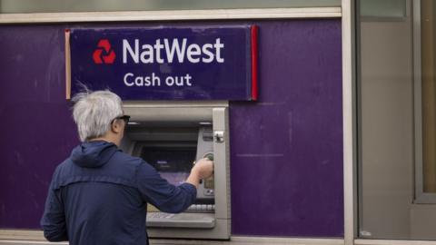 Customer using NatWest ATM