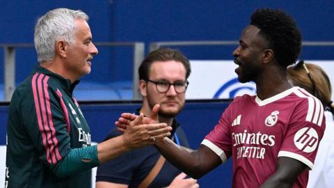 Jose Mourinho shaking hands with Vinicius Junior during Real Madrid's friendly with Schalke