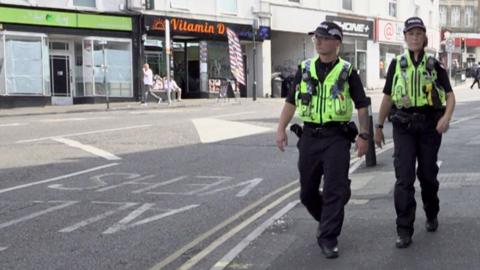 Two Dorset Police officers walking on the streets of Bournemouth