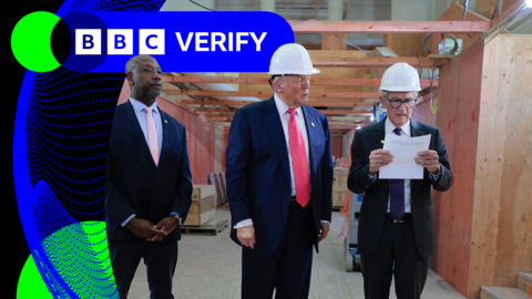 Donald Trump watches Jerone Powell as the Federal Reserve chairman reads a document. 