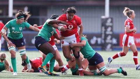 Sisi Tuipulotu playing rugby for Wales