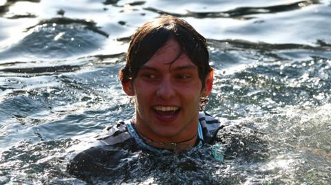 Race winner Kimi Antonelli swimming in the Monaco harbour after winning the grand prix