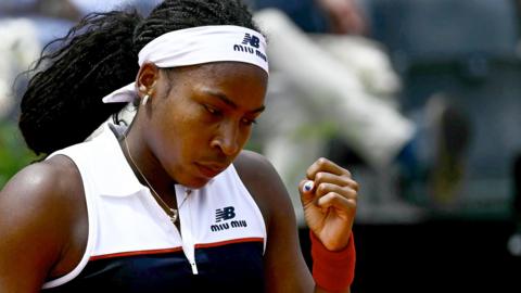 Coco Gauff clenches her fist after a winning a point against Mirra Andreeva
