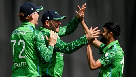 Ireland players celebrate taking a wicket
