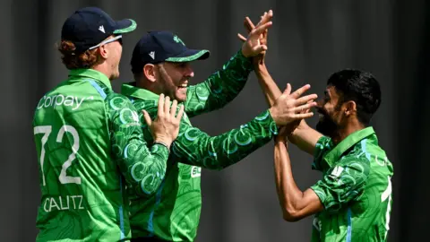 Ireland players celebrate taking a wicket