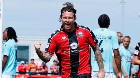 Tyler Harvey celebrates scoring Truro City's opening goal of the season