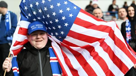 Rangers fan with a US flag