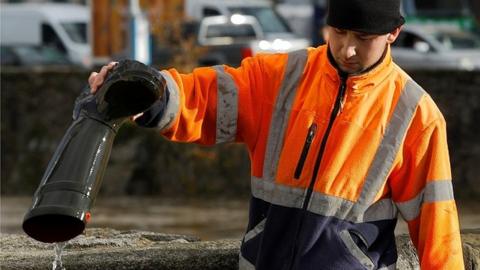 Man empties wellington boot