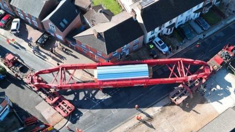 The abnormal load being moved through streets