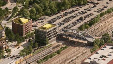 An artist's impression of the Station Quarter, with a new bridge over the road.