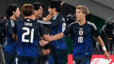 Japan celebrate a goal against Brazil