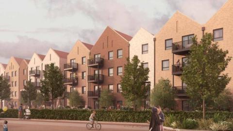 A computer generated image of the four storey apartment blocks which are going to be built in Guildford, Surrey. The apartments are differently coloured and have pointed roofs, and are also flanked by trees and bushes. 