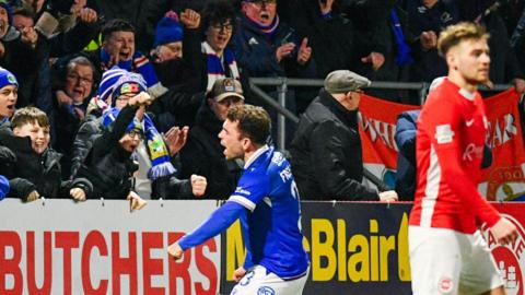 Frizzell celebrates scoring for Linfield against Larne