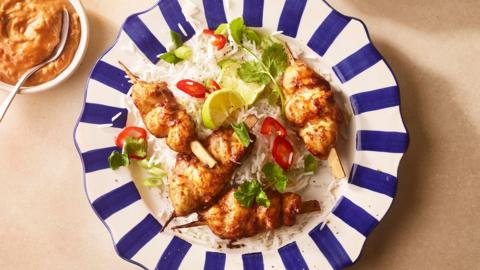 Air fryer peanut chicken on a stripe blue plate