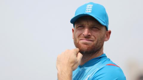 Jos Buttler holding his hand to his chin