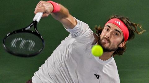 Stefanos Tsitsipas strikes the tennis ball 