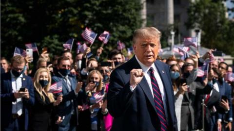 White House interns cheer Trump as he departs for the debate in Ohio