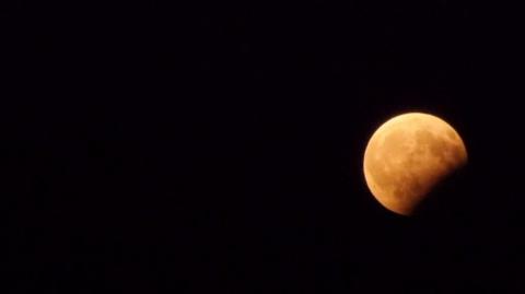 The red moon rising during the partial eclipse