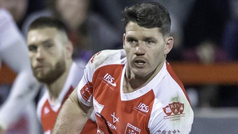 Lachlan Coote looks to pass the ball for Hull KR