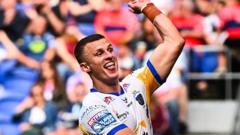 Ash Handley leaps in the air as he celebrates scoring a try against Bradford Bulls for Leeds Rhinos in their Magic Weekend win earlier this month