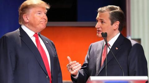 Republican presidential candidates (L-R) Donald Trump and Sen. Ted Cruz (R-TX) speak during a commercial break in the Fox Business Network Republican presidential debate at the North Charleston Coliseum and Performing Arts Center on January 14, 2016 in North Charleston, South Carolina.