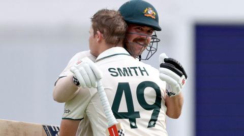 Australia's Travis Head and Steve Smith celebrate centuries against India