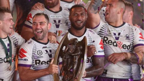 Melbourne Storm with the NRL trophy