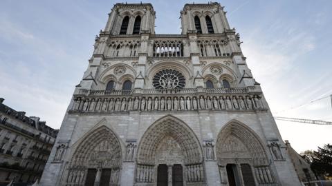 Image shows the North and South towers of Notre-Dame cathedral which sit either side of the West Rose window.