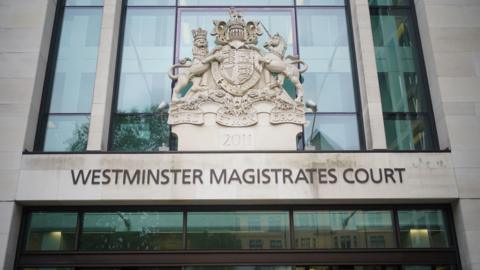 A photograph of the sign and crest above the main door Westminster Magistrates Court