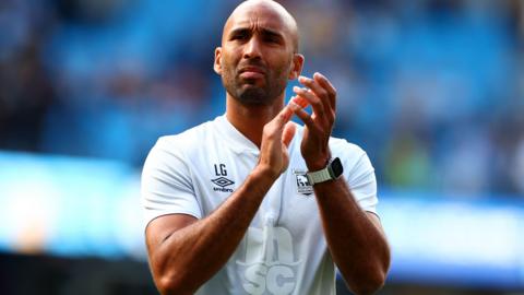 Lee Grant applauds the Ipswich fans