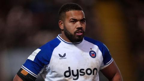 Ollie Lawrence standing on the field during a Bath match this season